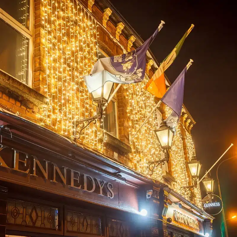 Connectable-LED-Curtain-Lights-3M-Warm-White-Side-Angle Connectable LED curtain lights 3m drop warm white on Kennedy's Pub Building side view