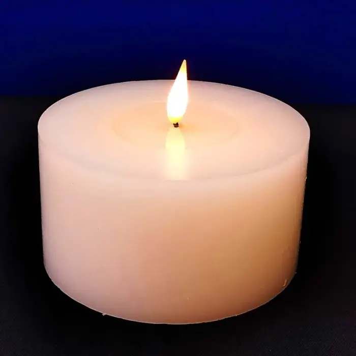 Battery operated Christmas wax candle in white colour for tabletop decor